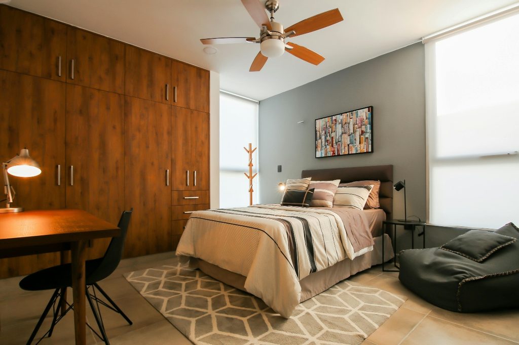 traditional bedroom with wood closet wall