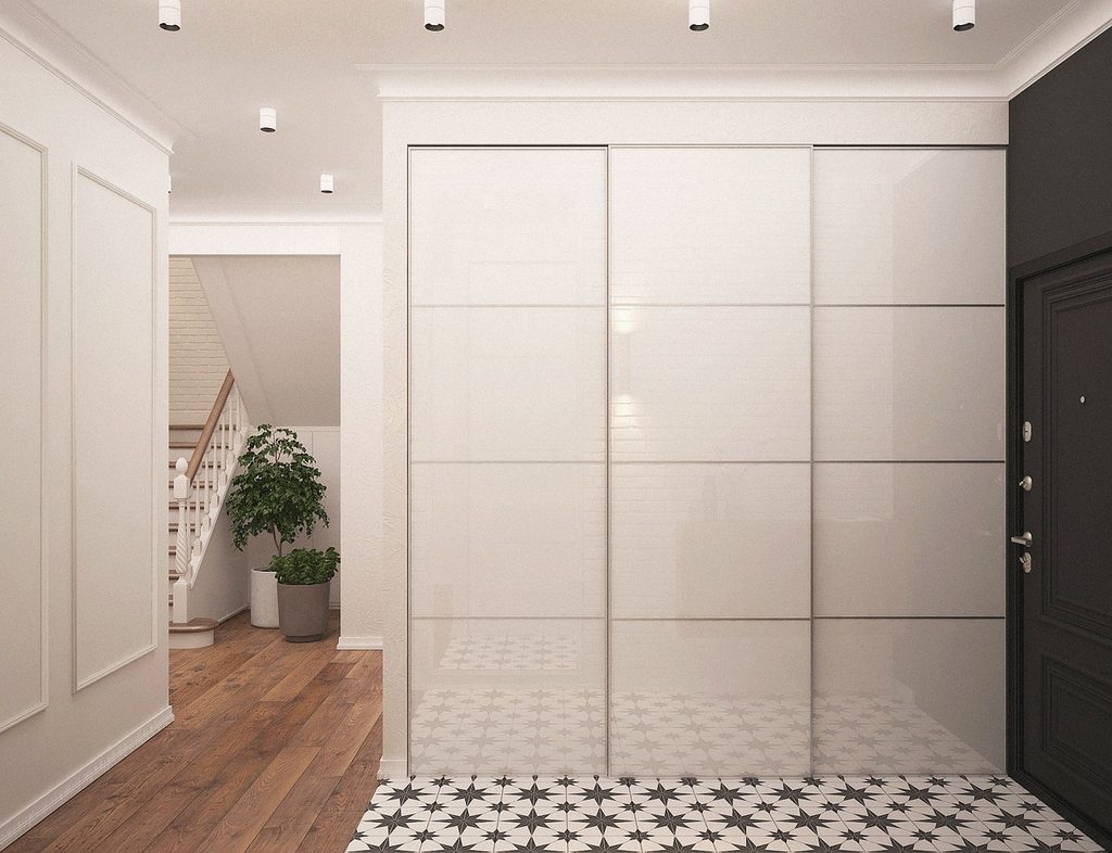 White hidden storage in foyer
