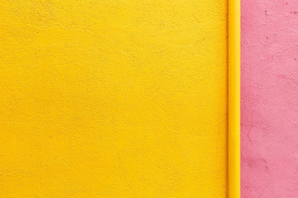 Bright yellow and pink painted wall