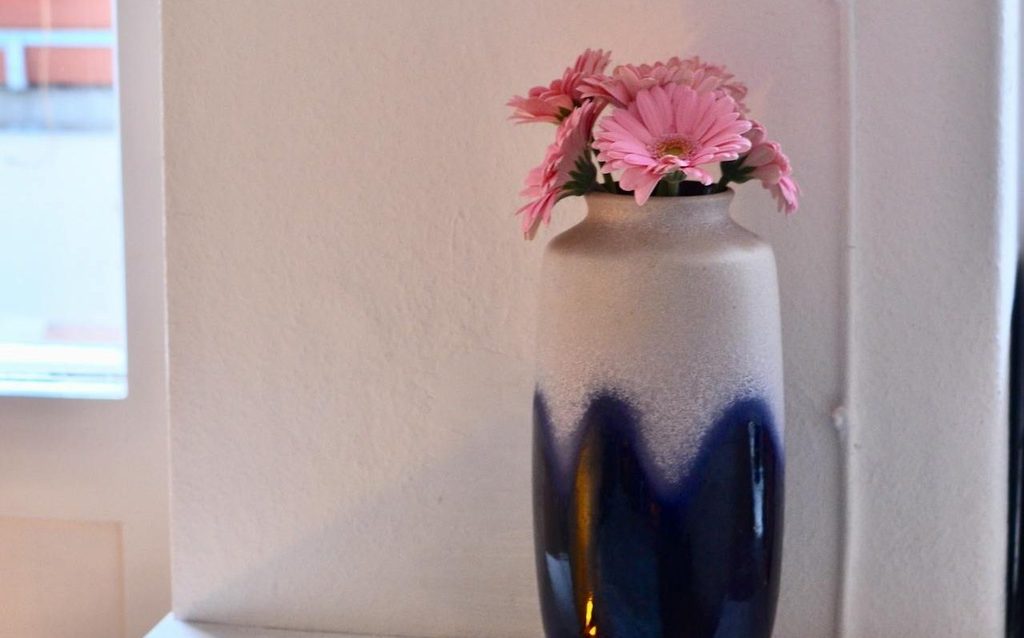 Navy and white vase with pink flowers