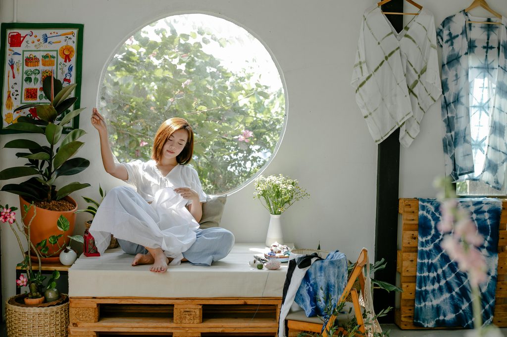 woman sitting on window bench in japanese style home