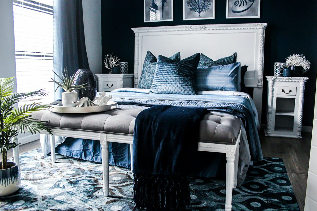 Bedroom with black walls and bedding