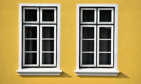 Closed white wooden-framed glass windows
