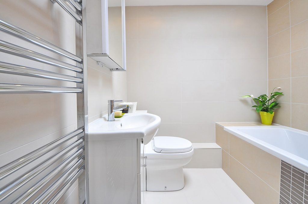 Clean bathroom with deep medicine cabinet.