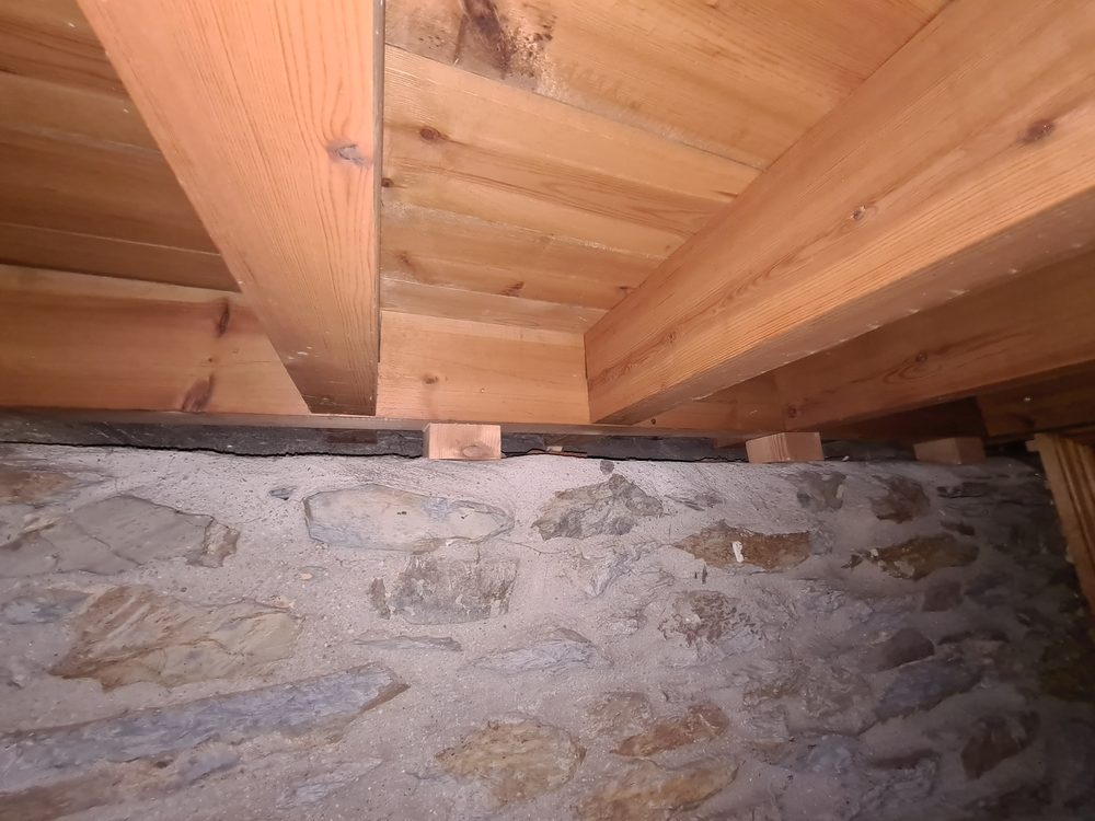 Flooring joists at sublevel of house.