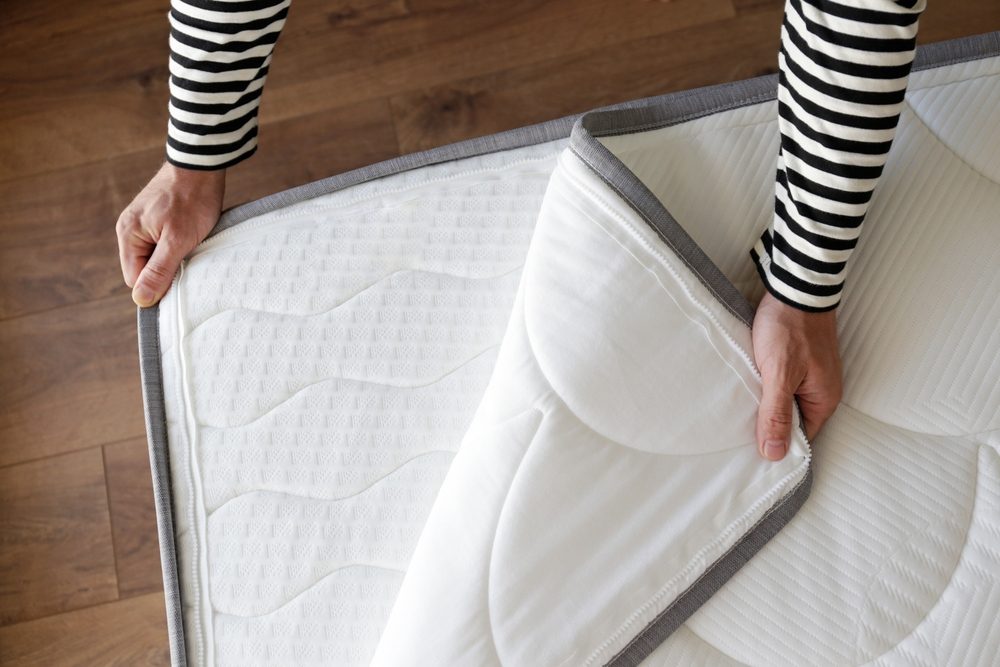 Putting a mattress protector on a mattress