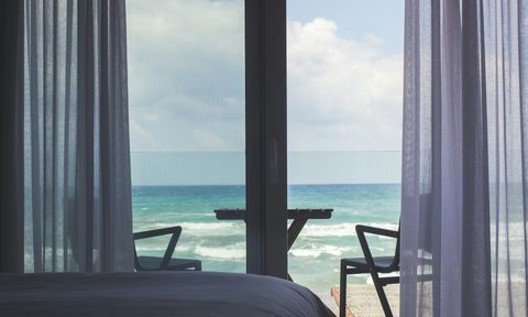 Beachside balcony door with sliding door window treatments