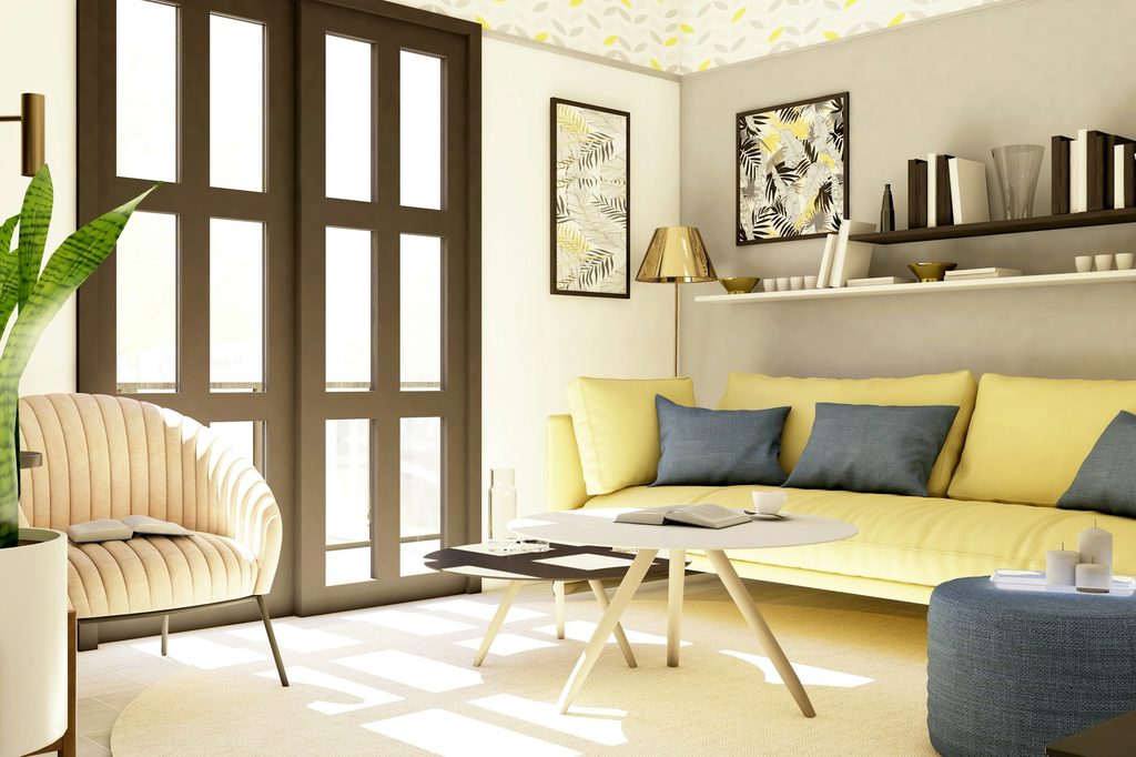 Living room with butter yellow couch and blue and black accents