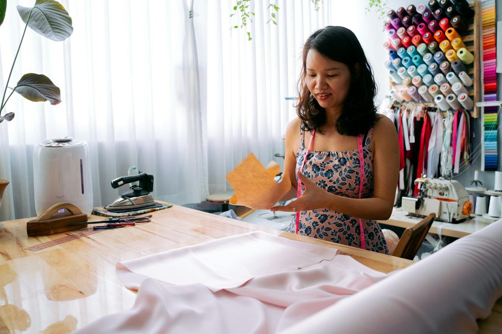 woman doing sewing project in craft room