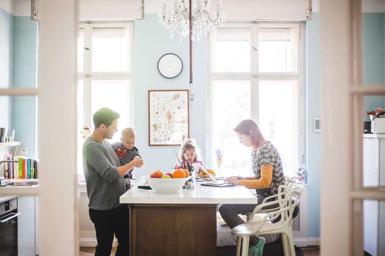 family enjoying time in kitchen