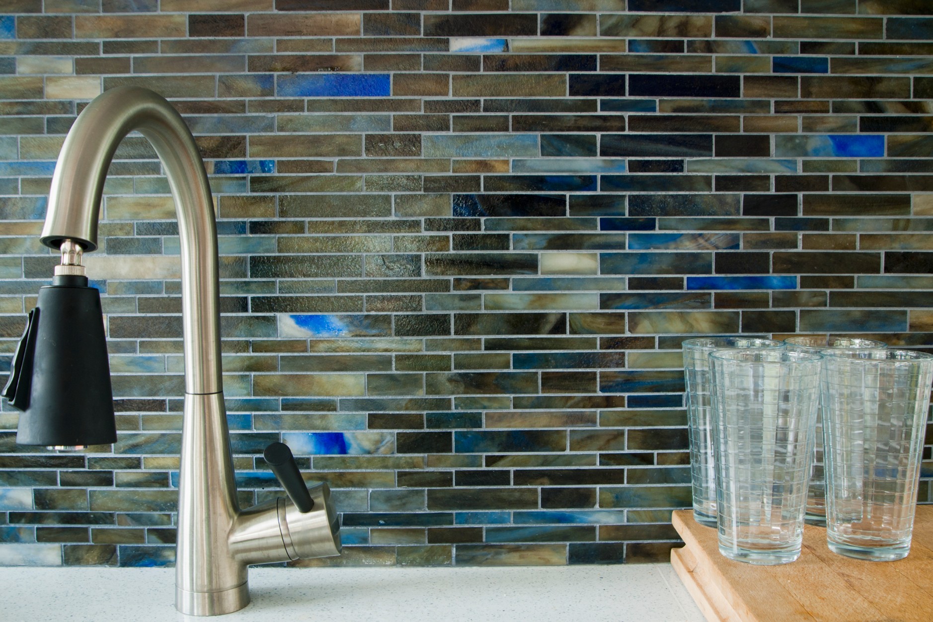 Kitchen counter with sink and glasses