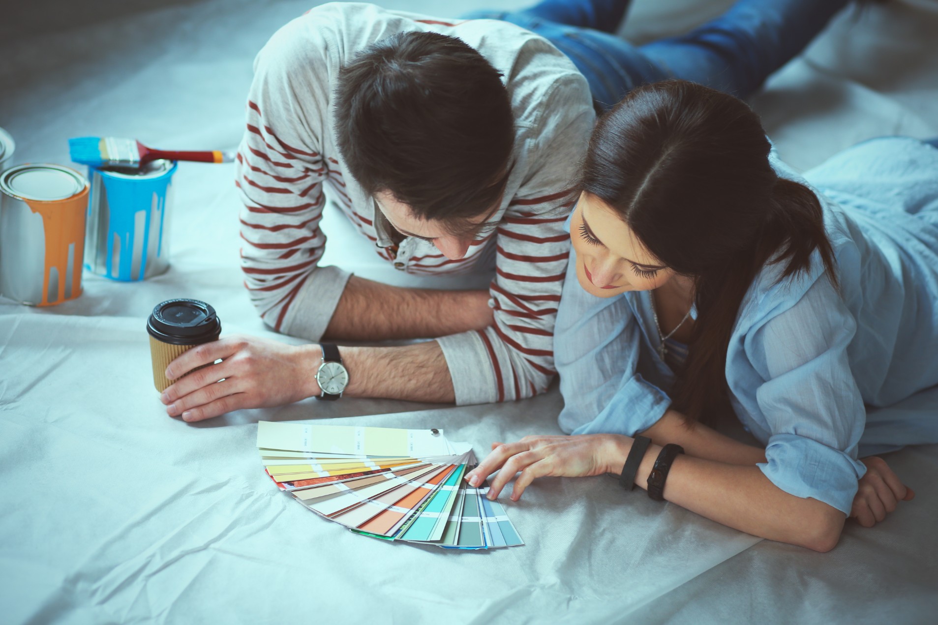 Man and woman looking at paint samples