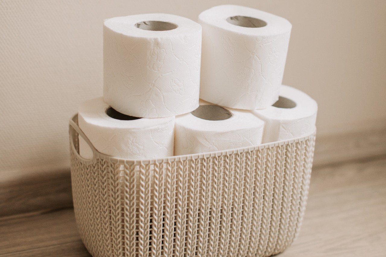 Wicker basket holding toilet paper