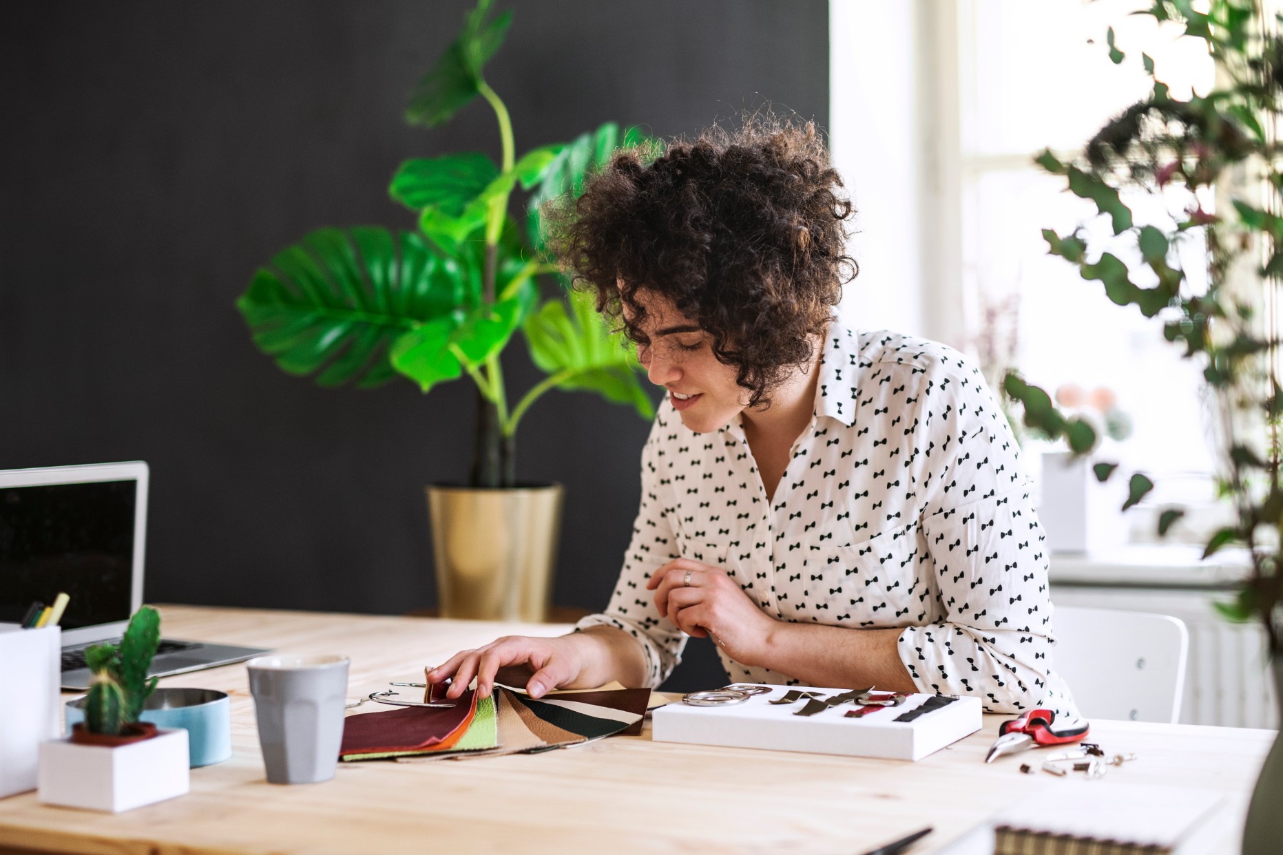 Woman at desk looking at paint samples