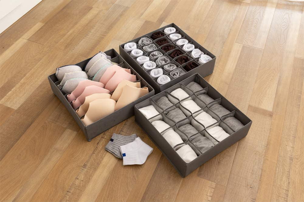 organized drawer divider with clothing items