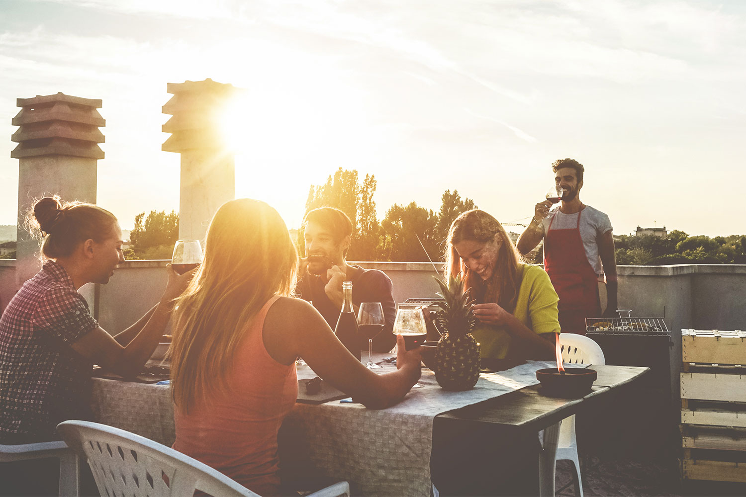 patio with dining area and people sitting