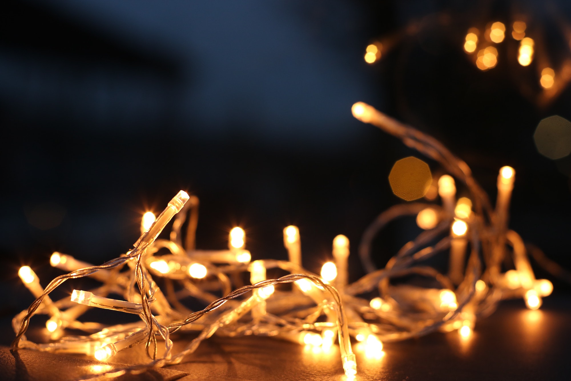 white fairy lights gathered on table