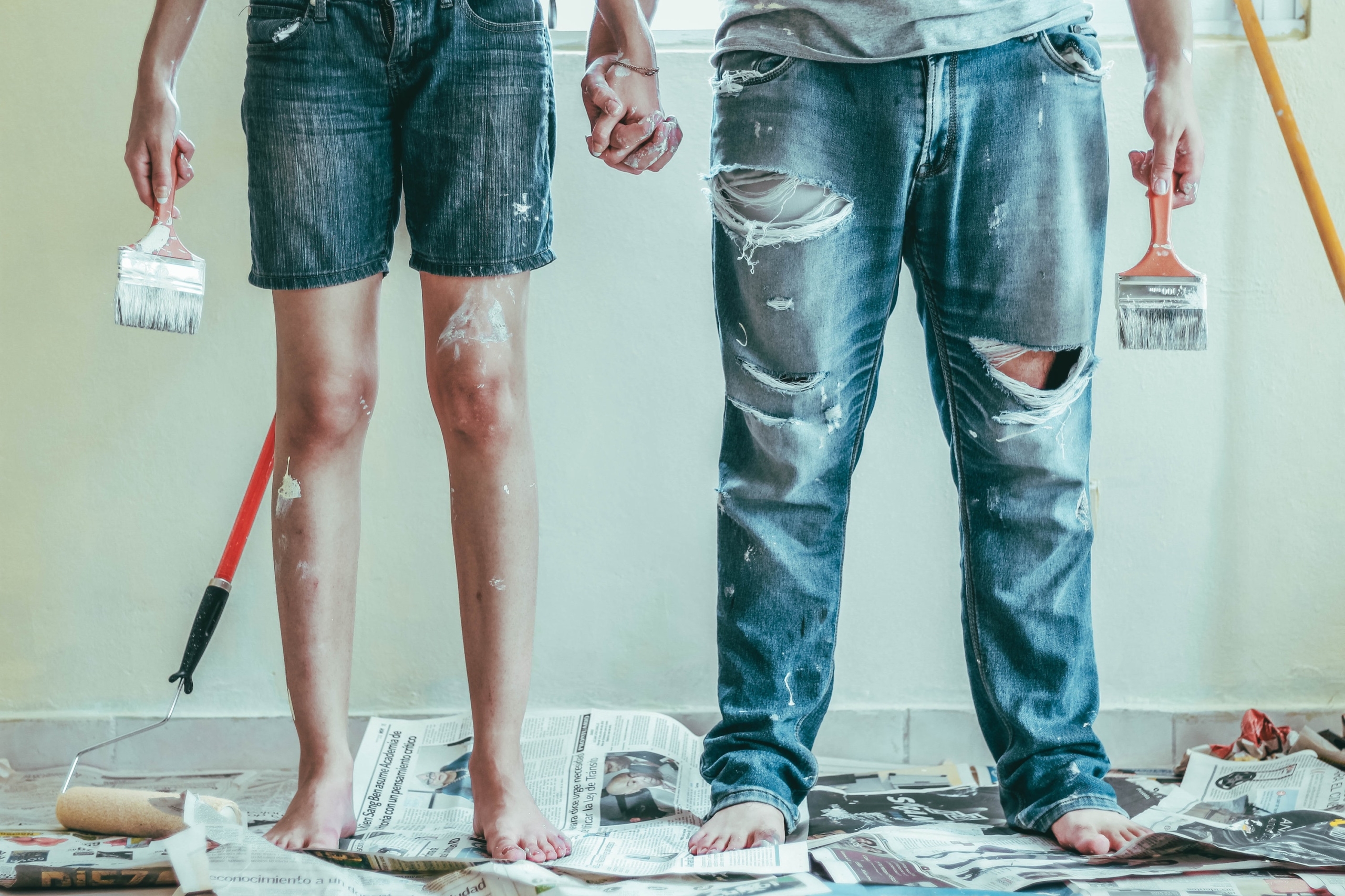 two people with paint on clothing