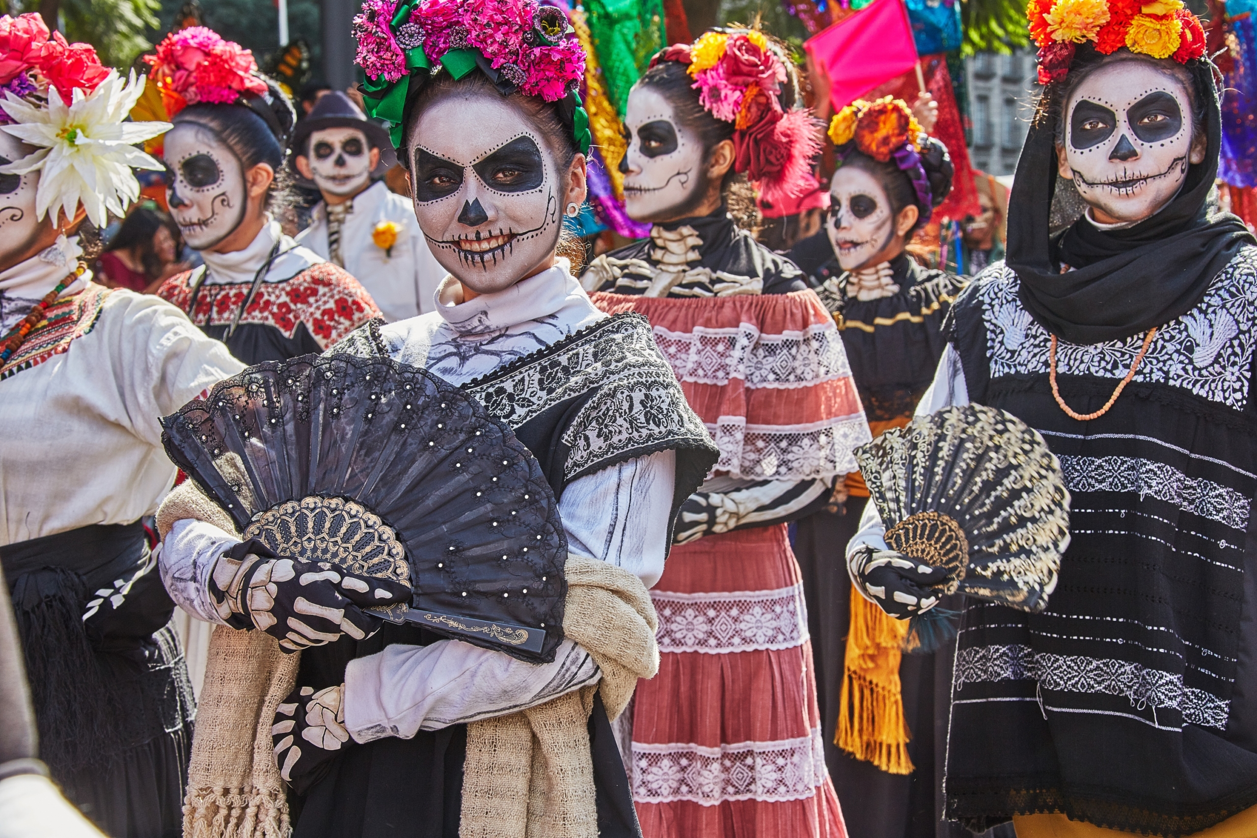 people dressed in costume for dia de los muertos