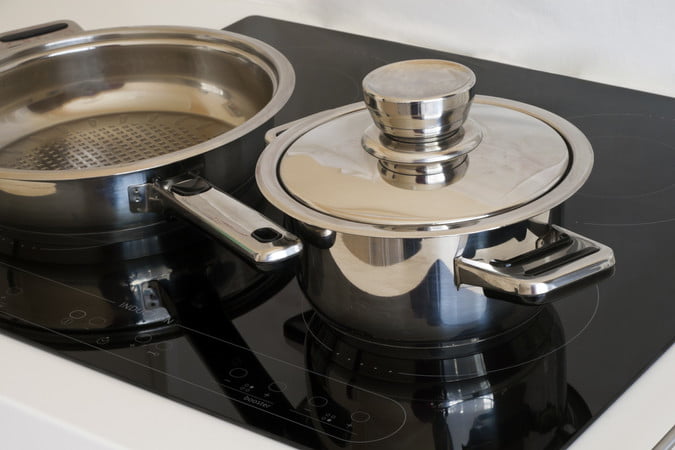 Two stainless steel pots on stove