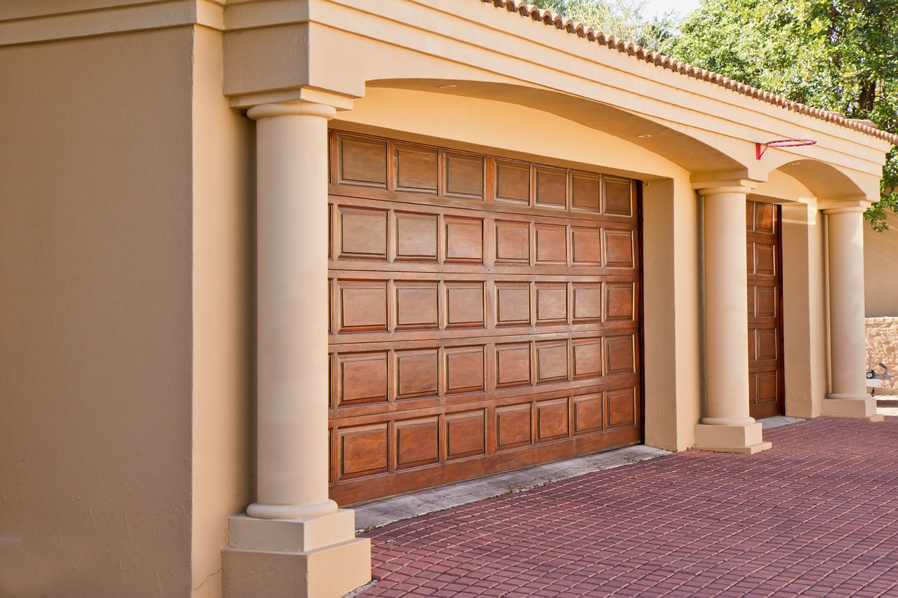 Wooden garage door with cream colored columns