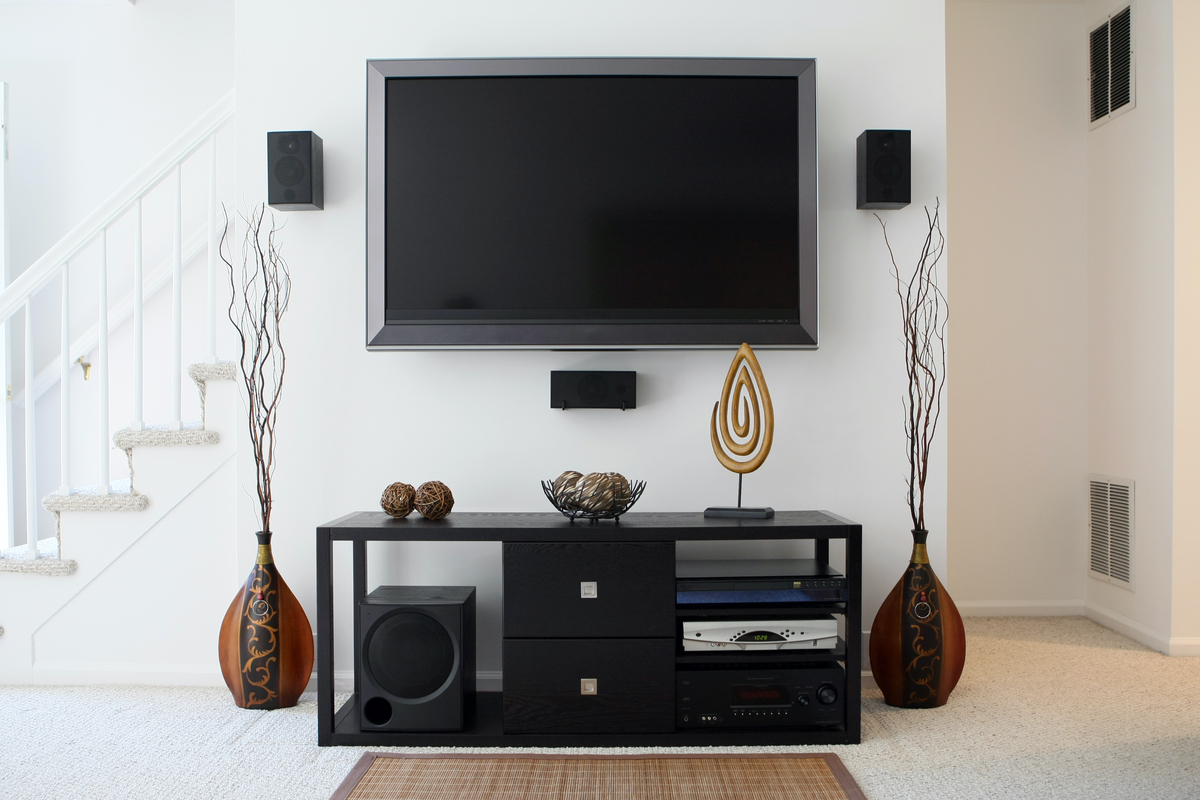 Wall-mounted TV with entertainment center below