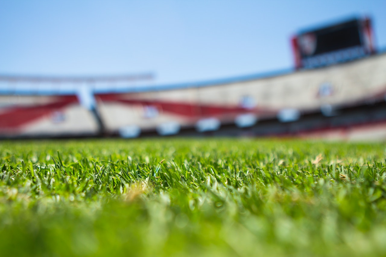football stadium turf with empty stands
