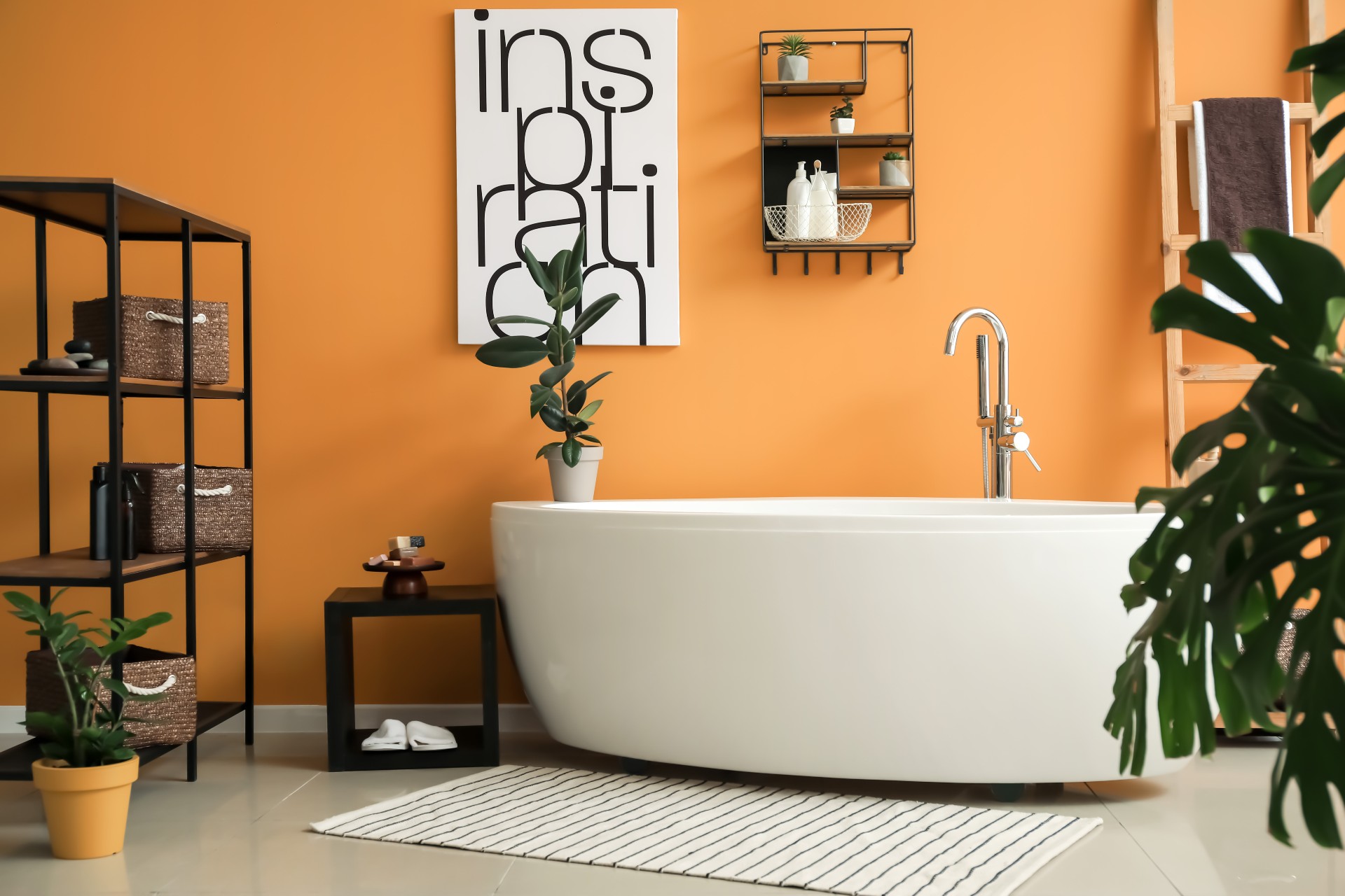 Bathroom with orange walls and a plant