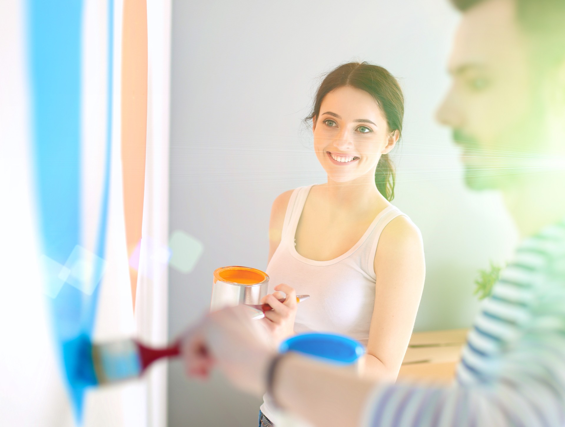 man and woman painting with two colors