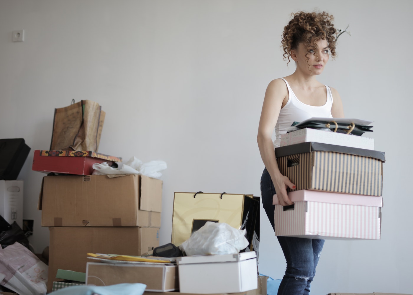 A woman organizing and moving boxes