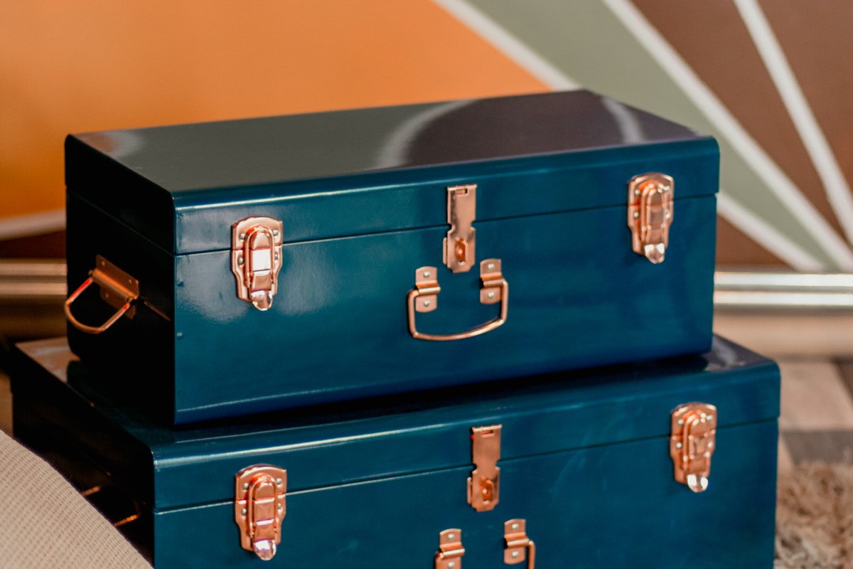 Vintage blue suitcases stacked up.