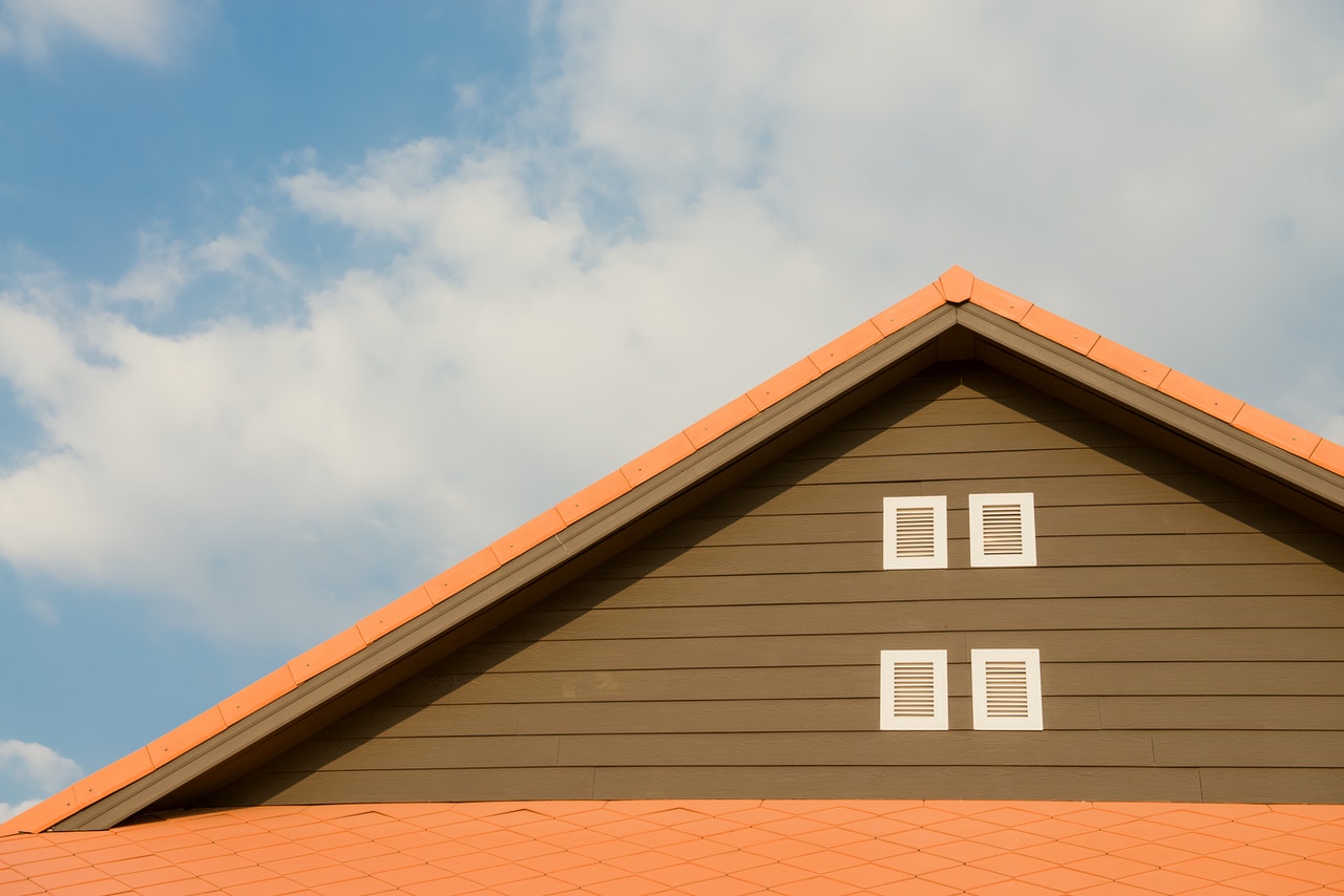 orange and brown house with pointed roof