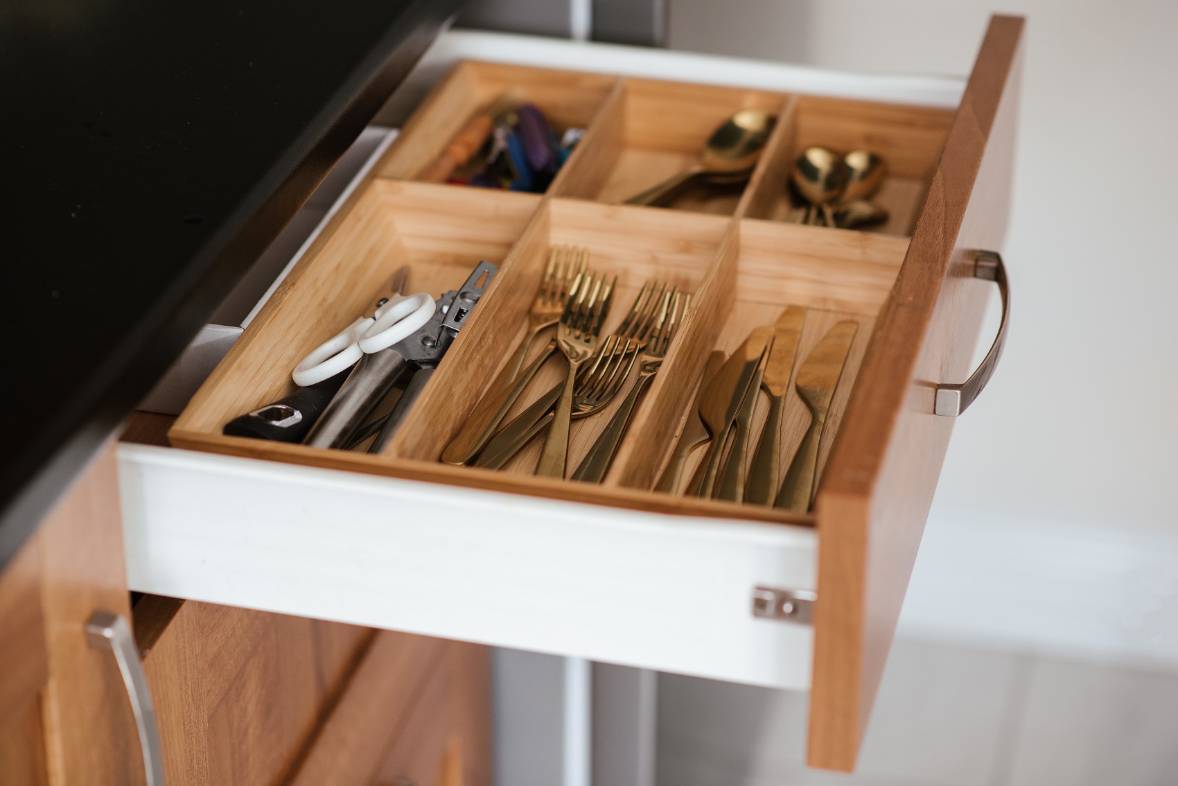 silverware drawer with gold flatware