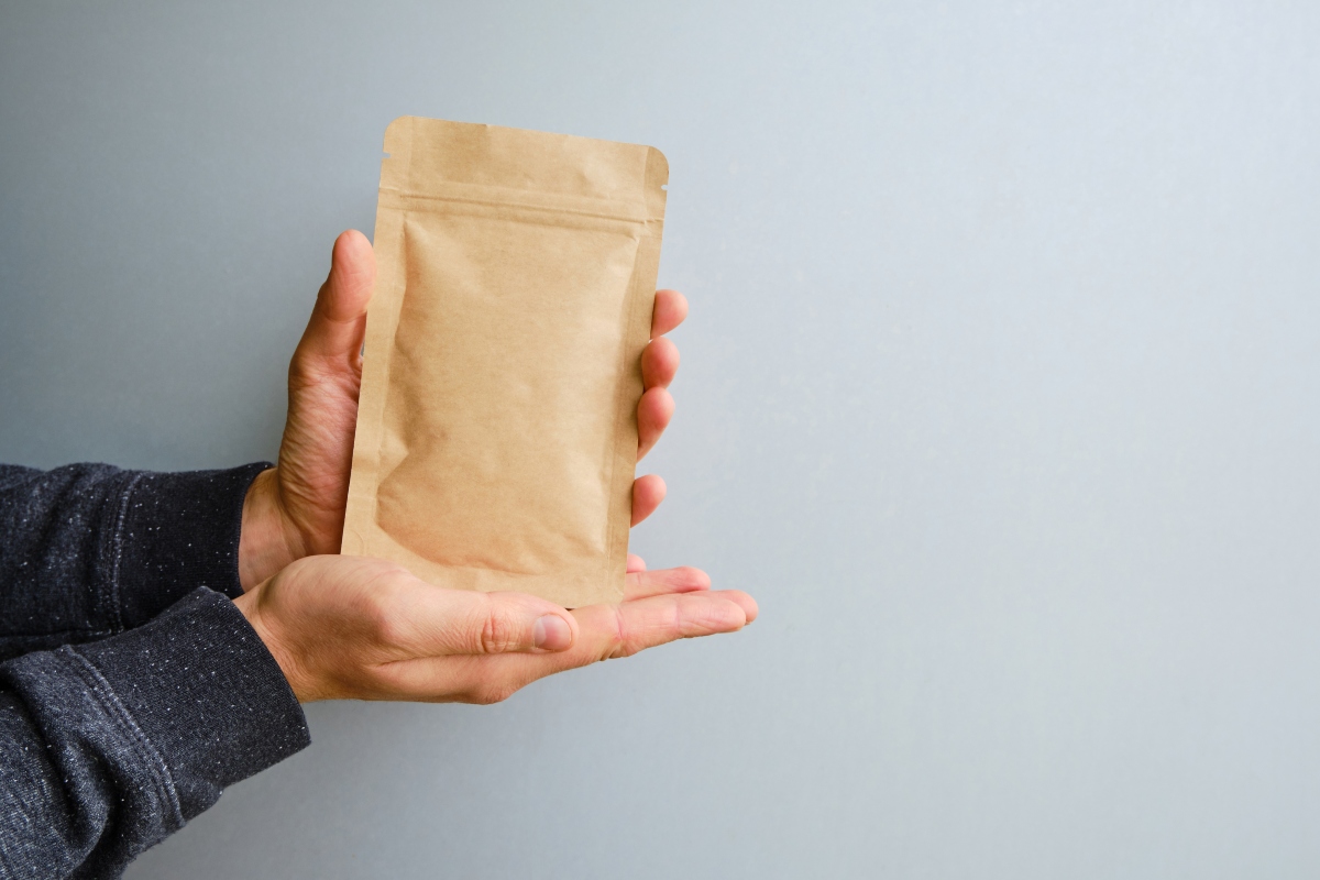 person holding eco friendly paper packaging