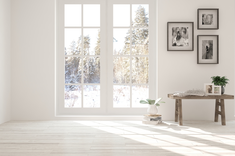Winter outside through french doors in white living room