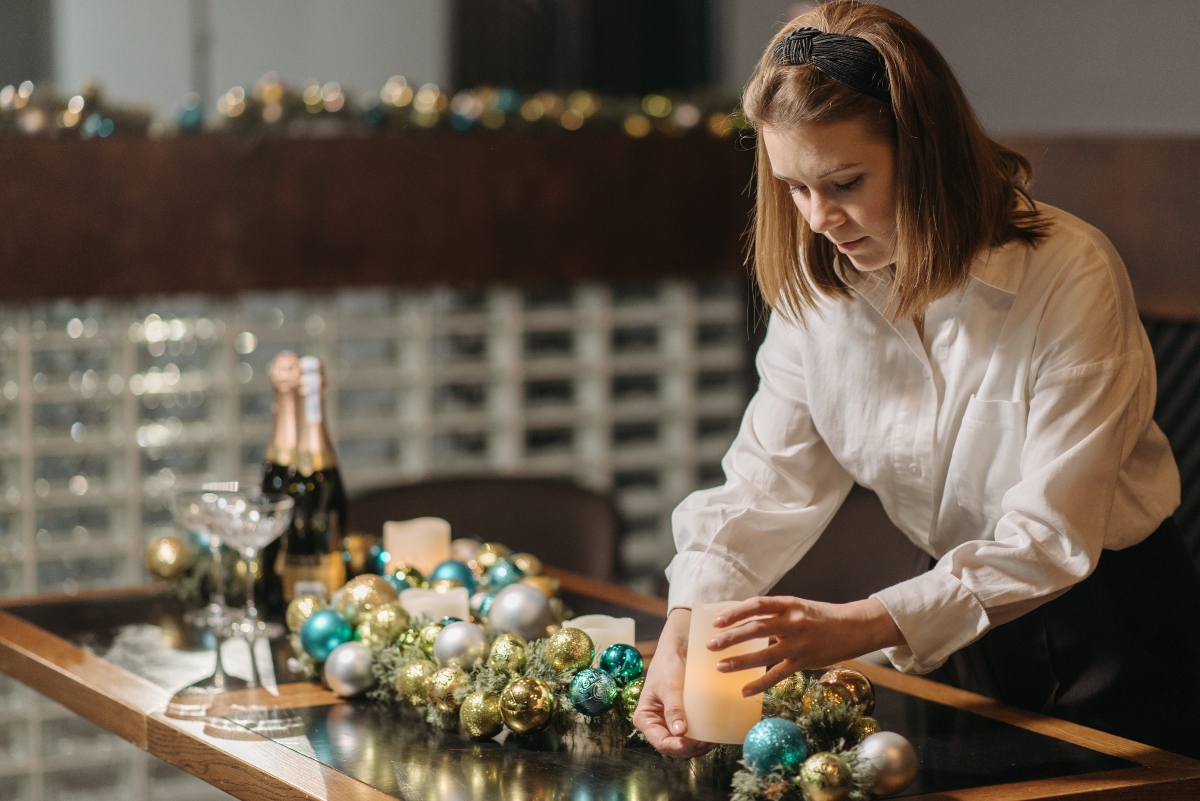 Woman decorating table for holiday party