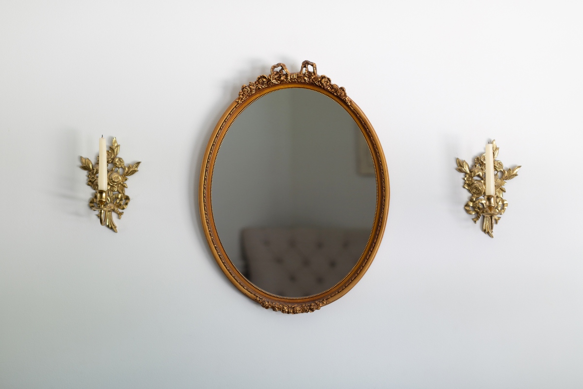 gold antique distressed mirror on white wall
