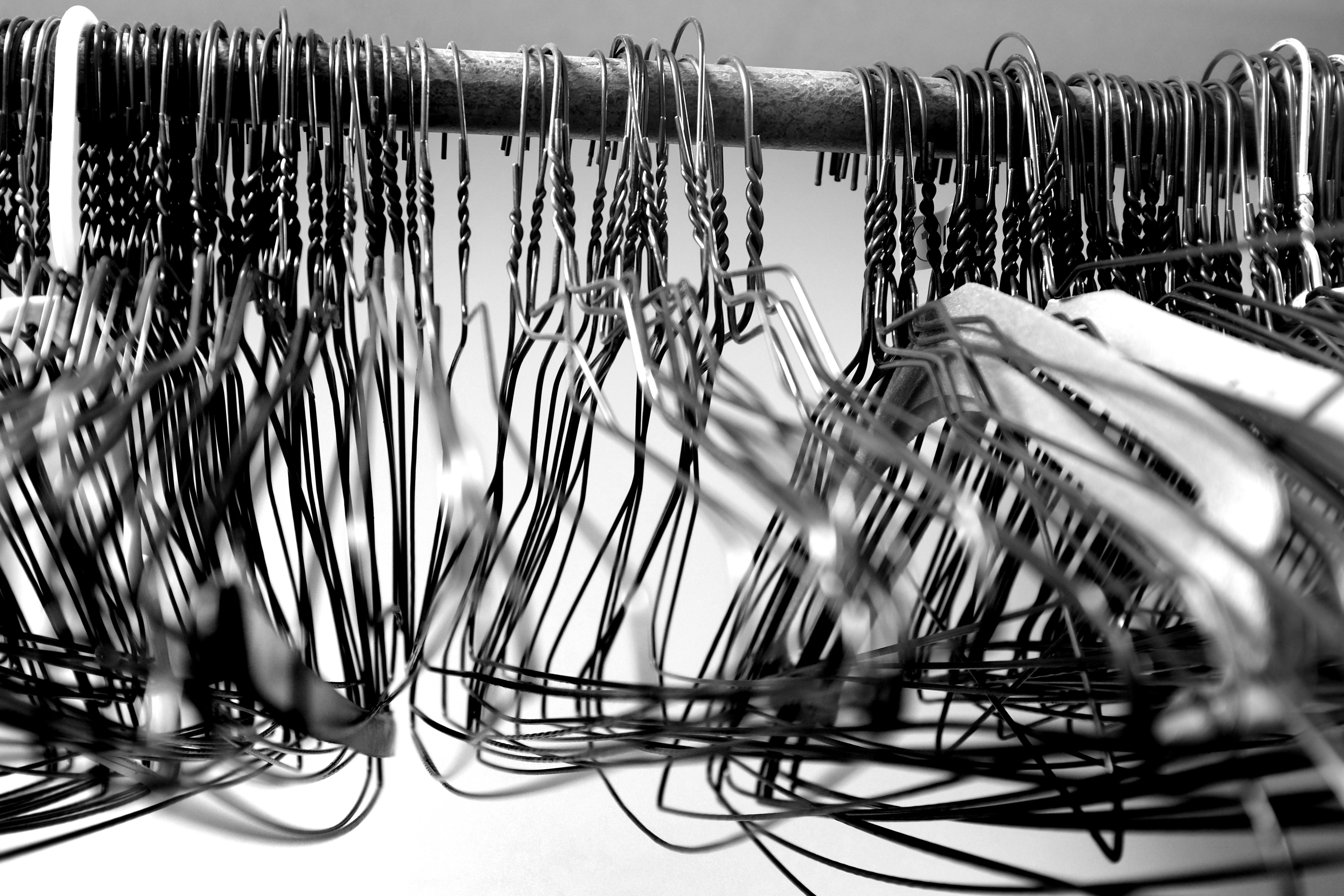 wire hangers on a closet rod