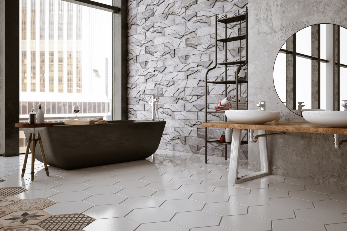 Black and white bathroom with black tub and large window with lots of light