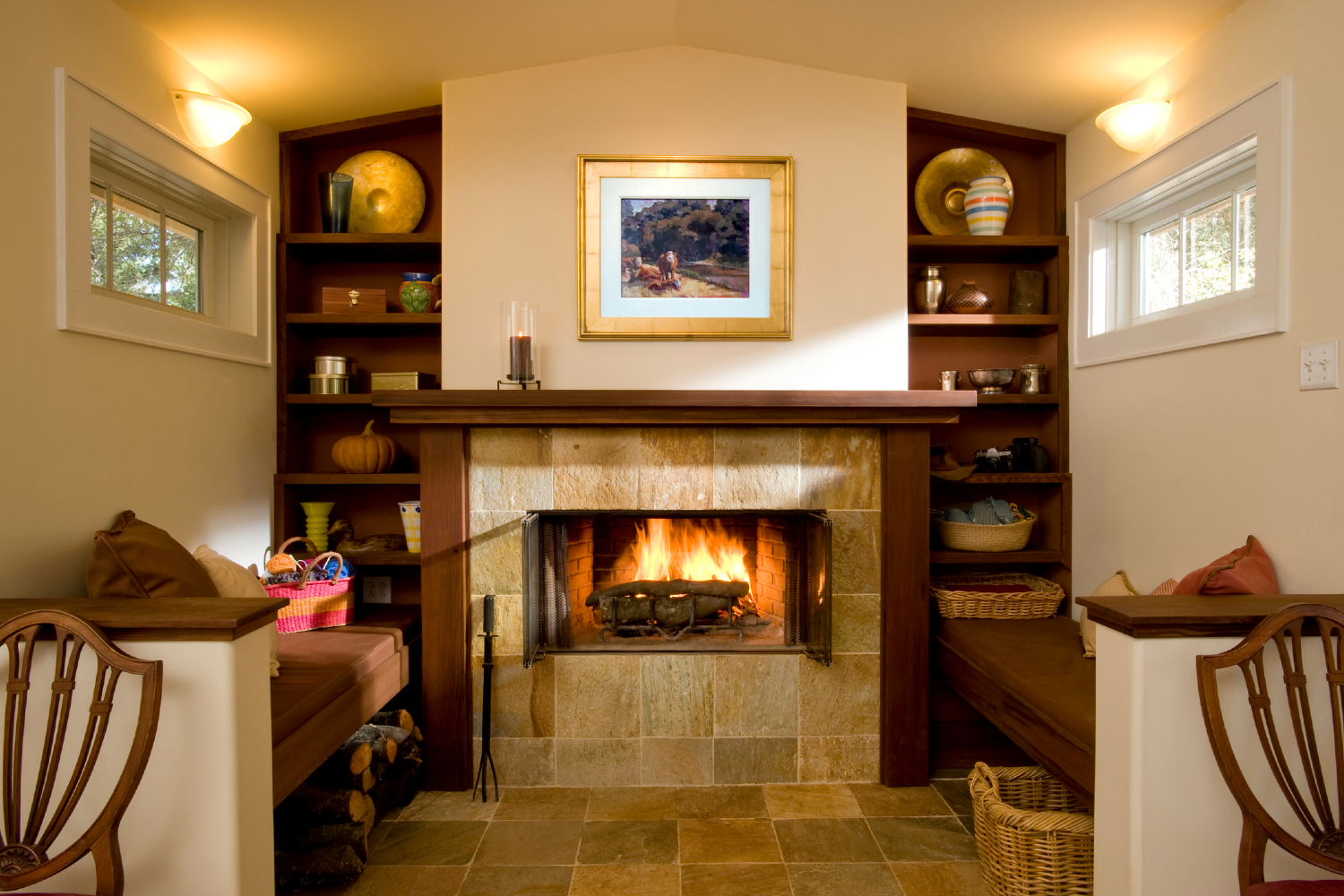 Decluttered mantle with art and candle.