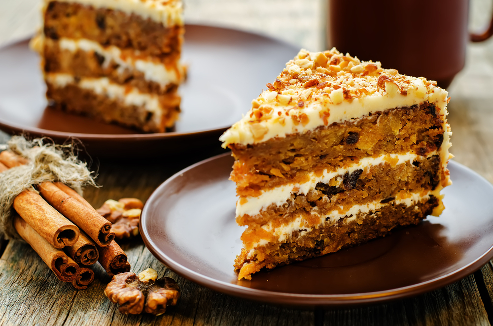 layered carrot cakes on brown plates