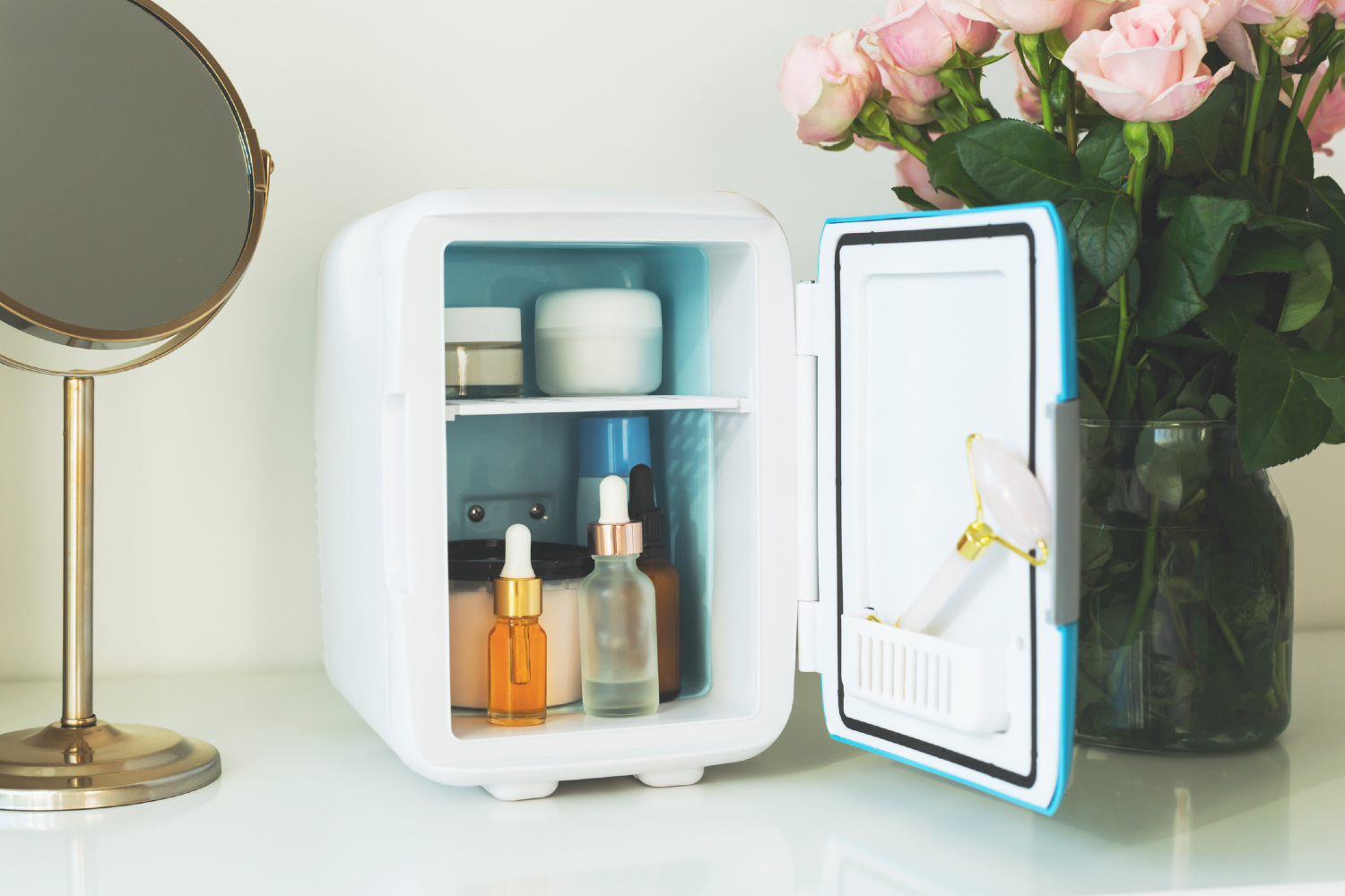 Mini fridge with skincare products inside.