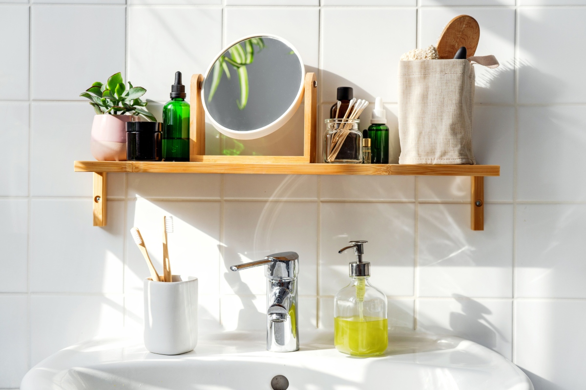 Small bathroom wood shelf with minimal decor above sink