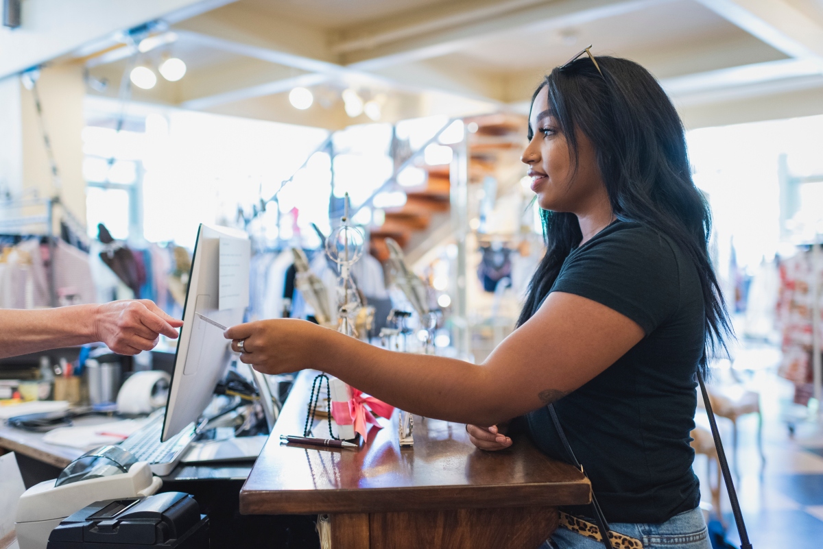 woman shopping in store with a credit card