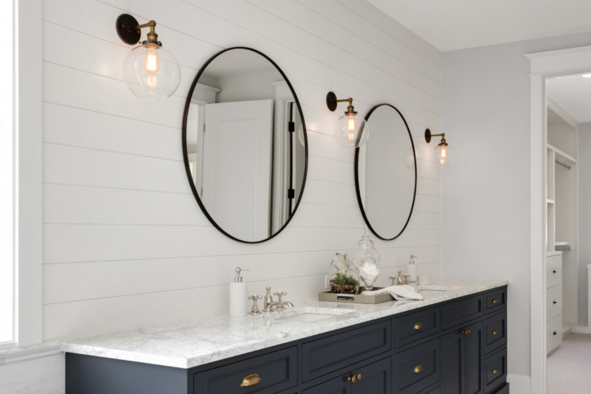 mid century modern wall sconce in modern bathroom