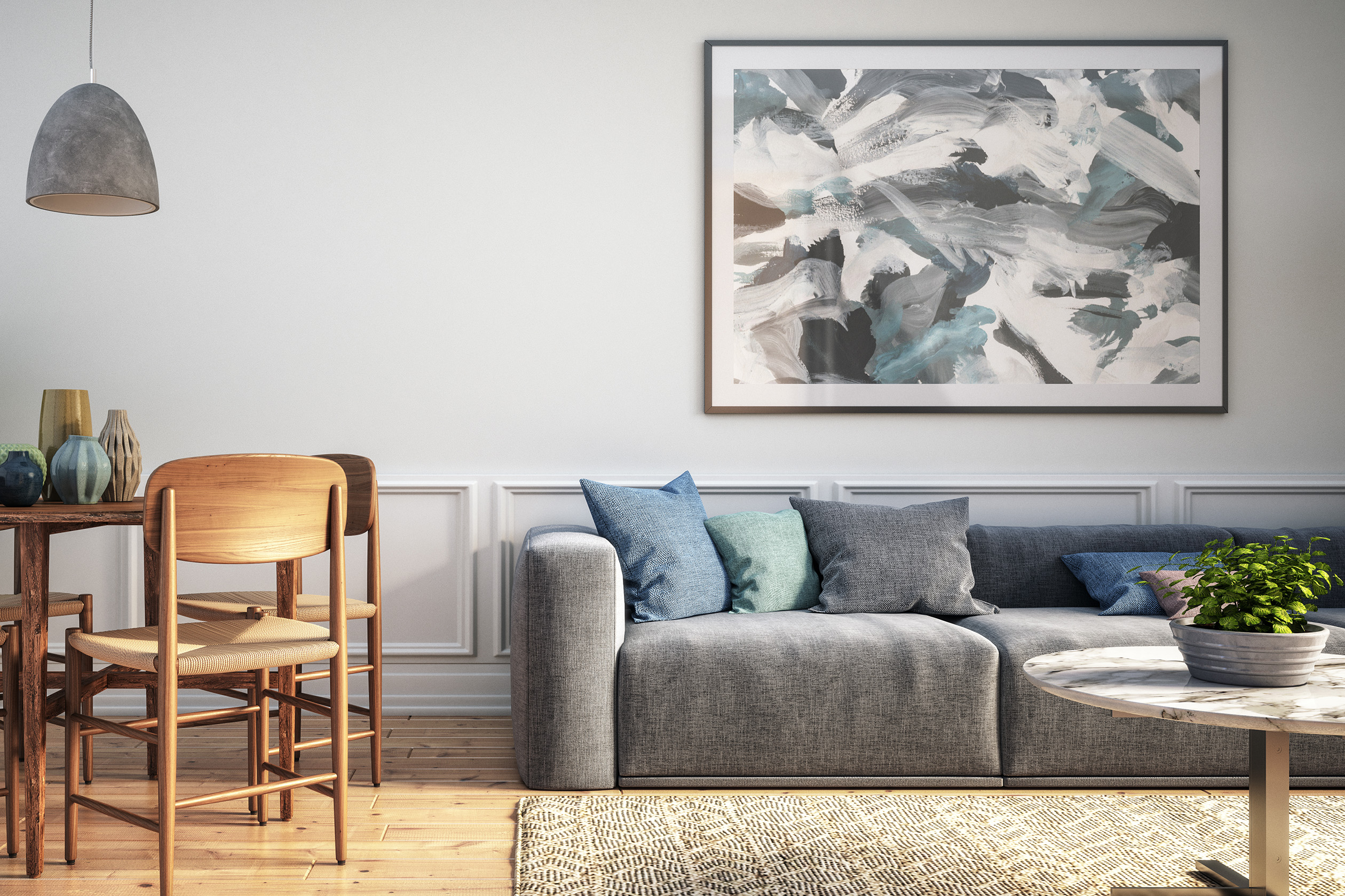 Living area with abstract art hanging over the couch