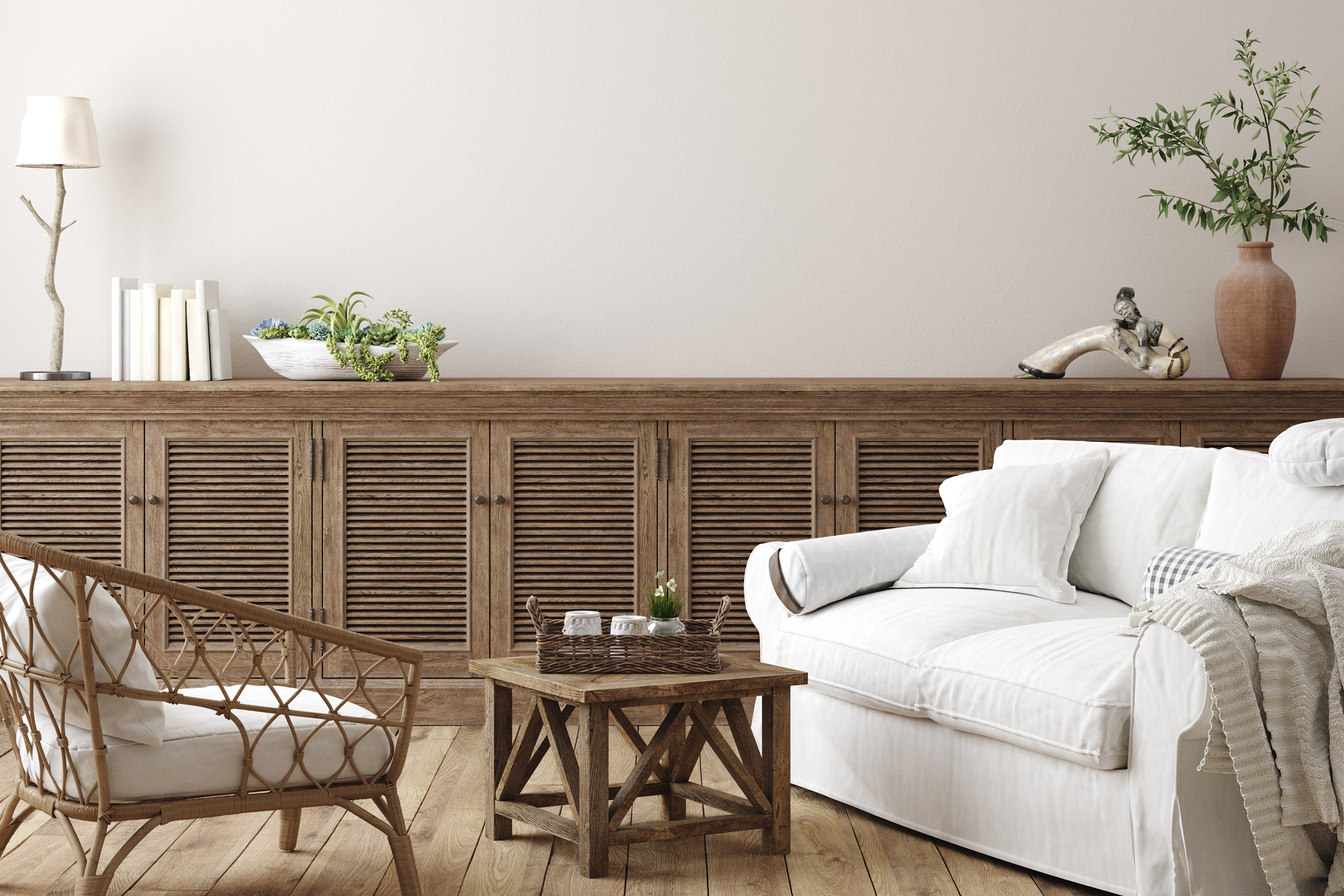 Coastal farmhouse living room with white couch and rustic accents