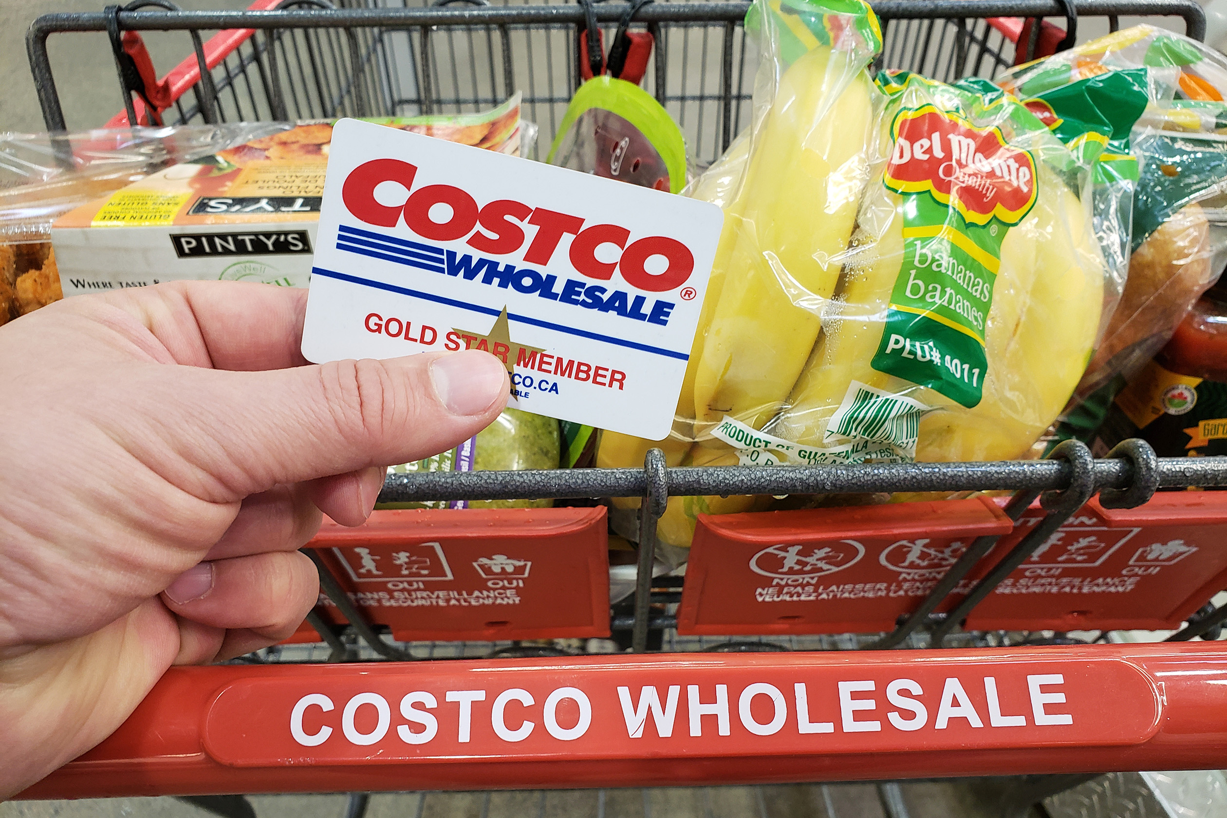 Person grocery shopping with a Costco membership