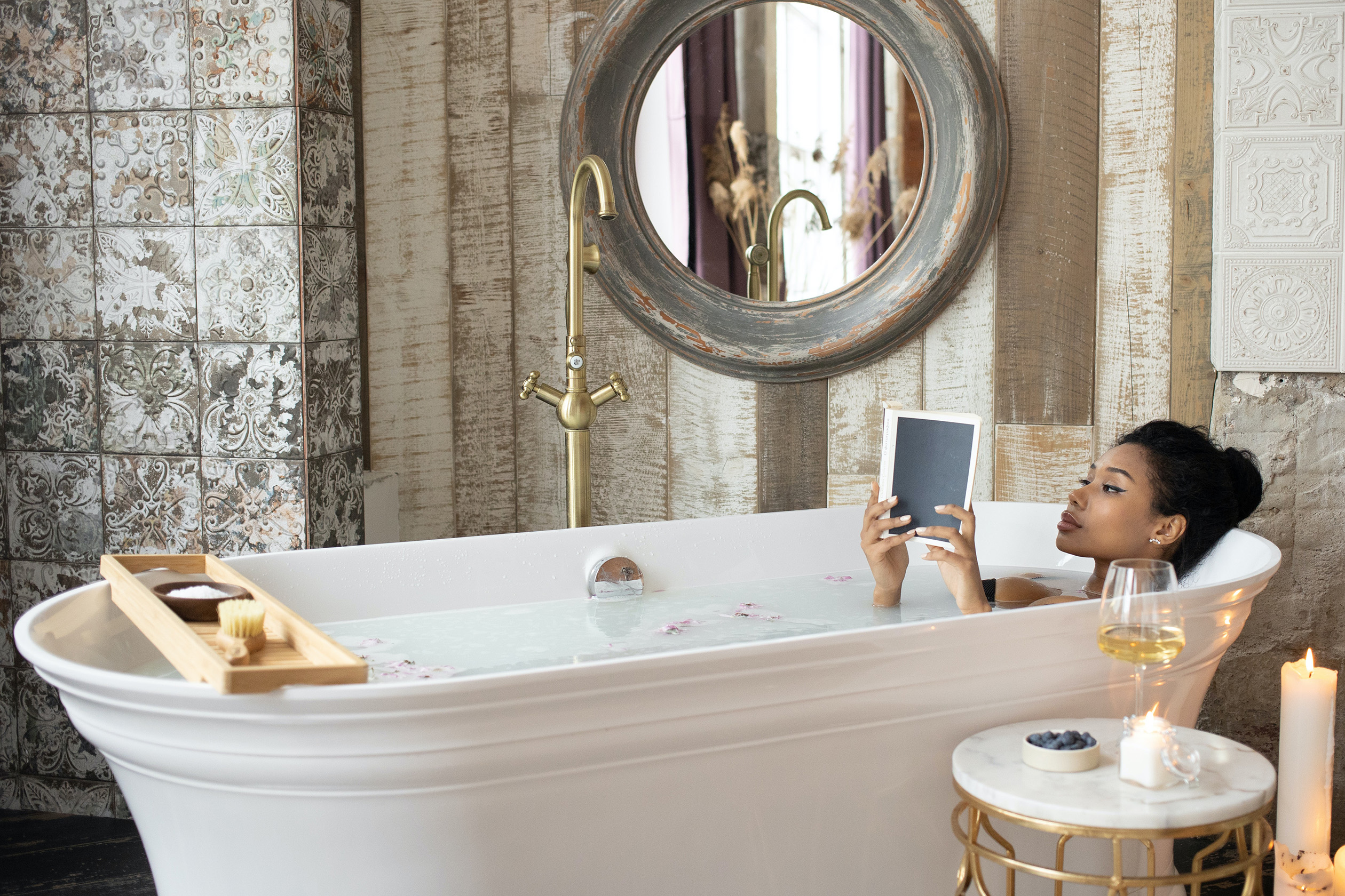 Woman relaxing in bathtub