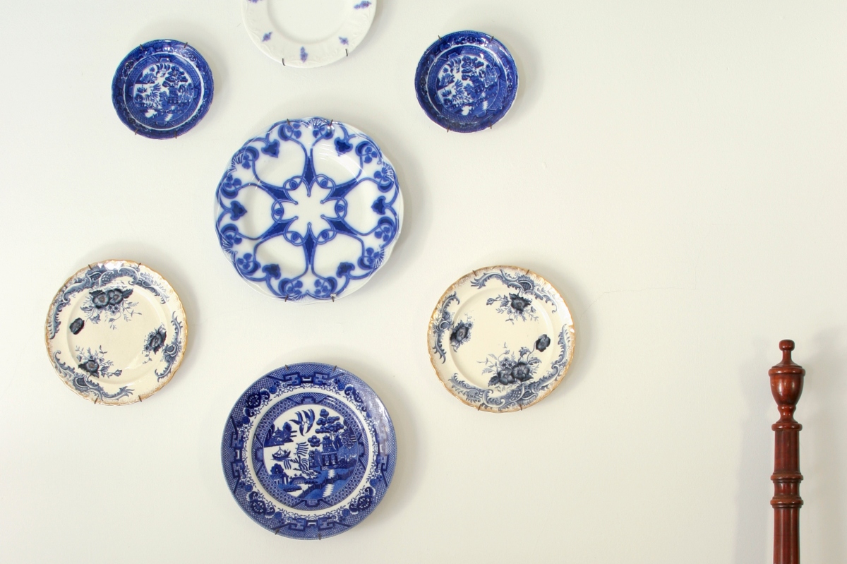 blue and white porcelain plates hung as wall art